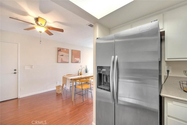 430 N Holliston Ave Unit 210, Pasadena, CA 91106 - kitchen featuring stainless steel fridge with ice dispenser, a ceiling fan, wood finished floors, light countertops, and white cabinetry