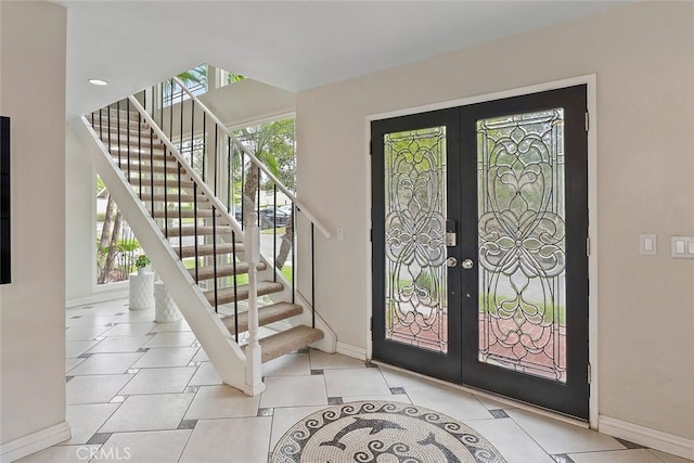 22702 Islamare Ln, Lake Forest, CA 92630 - entrance foyer with french doors, baseboards, stairway, and tile patterned flooring