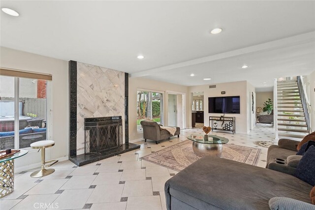 22702 Islamare Ln, Lake Forest, CA 92630 - living area with healthy amount of natural light, baseboards, recessed lighting, a fireplace, and stairway