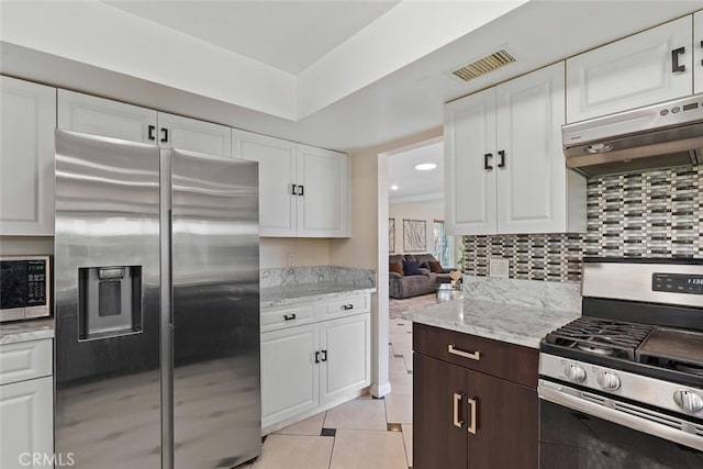 22702 Islamare Ln, Lake Forest, CA 92630 - kitchen featuring appliances with stainless steel finishes, white cabinets, light tile patterned floors, backsplash, and recessed lighting