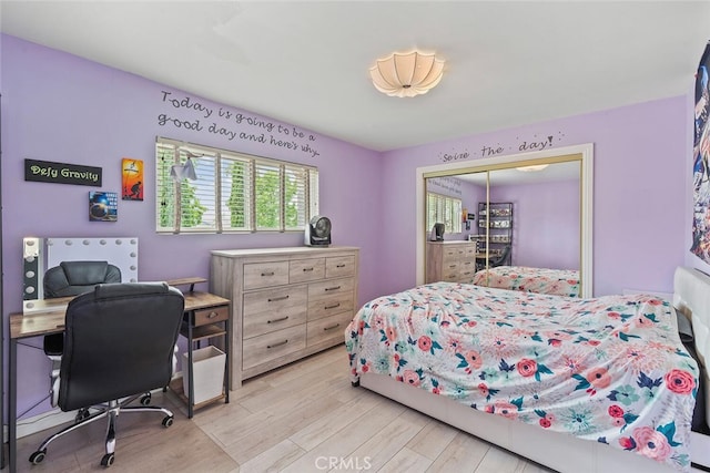 22702 Islamare Ln, Lake Forest, CA 92630 - bedroom featuring light wood-style floors, a closet, and a desk