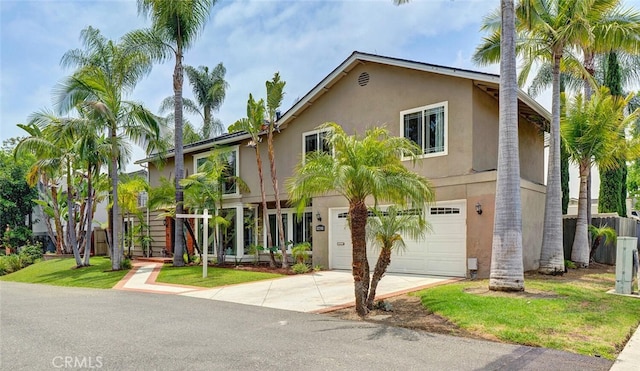 22702 Islamare Ln, Lake Forest, CA 92630 - view of front of home featuring concrete driveway, a garage, and stucco siding
