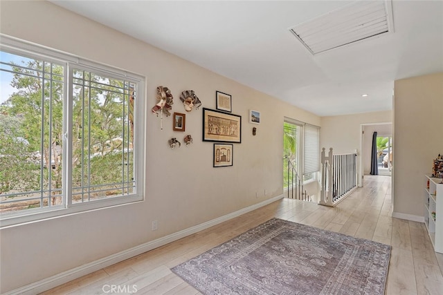 22702 Islamare Ln, Lake Forest, CA 92630 - hallway featuring plenty of natural light, wood finished floors, baseboards, an upstairs landing, and recessed lighting
