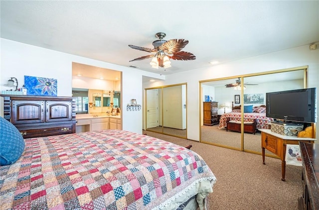 1390 Corona Ave, Norco, CA 92860 - carpeted bedroom featuring two closets, a ceiling fan, and connected bathroom