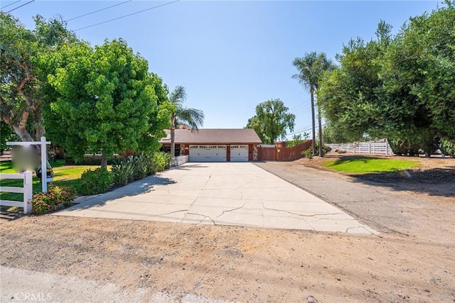 1390 Corona Ave, Norco, CA 92860 - view of property hidden behind natural elements featuring concrete driveway