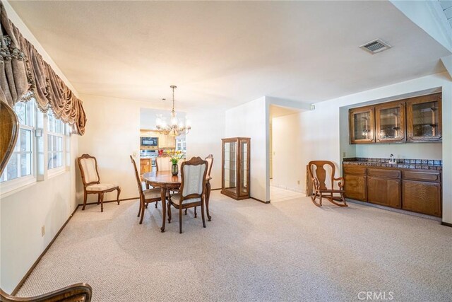 1390 Corona Ave, Norco, CA 92860 - dining room featuring light colored carpet and a chandelier