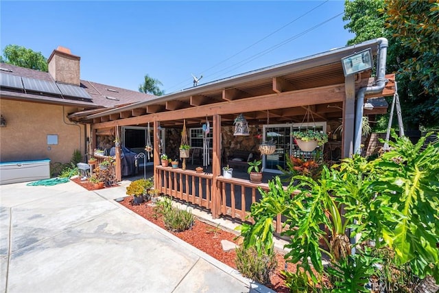 1390 Corona Ave, Norco, CA 92860 - property entrance featuring a patio area and a chimney