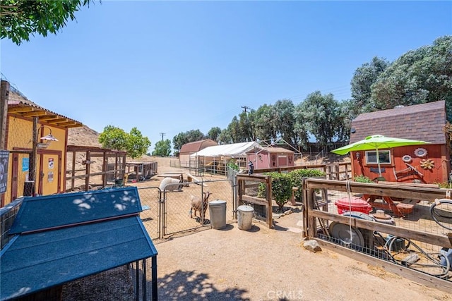 1390 Corona Ave, Norco, CA 92860 - view of yard featuring an outbuilding and a gate