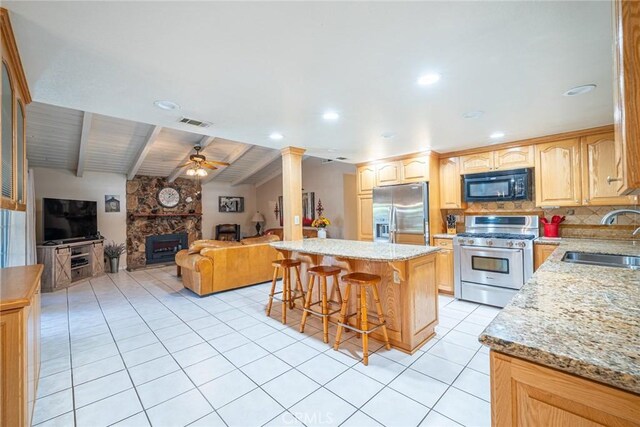 1390 Corona Ave, Norco, CA 92860 - kitchen with appliances with stainless steel finishes, open floor plan, ceiling fan, a kitchen breakfast bar, and beamed ceiling