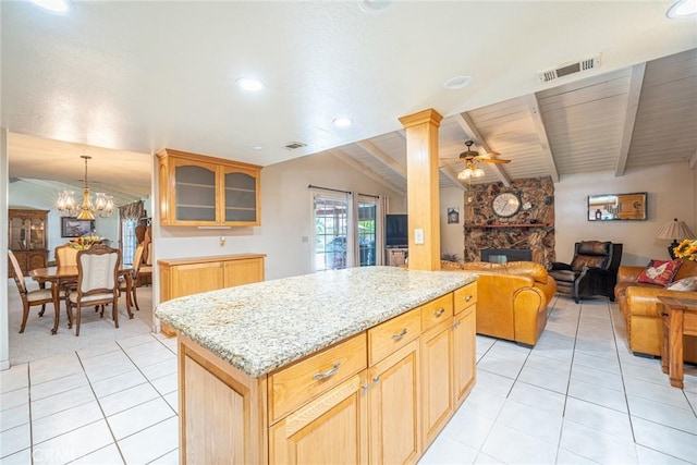 1390 Corona Ave, Norco, CA 92860 - kitchen featuring a ceiling fan, a fireplace, light tile patterned flooring, a chandelier, and glass insert cabinets
