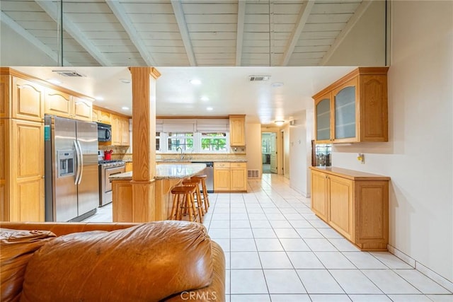 1390 Corona Ave, Norco, CA 92860 - kitchen featuring appliances with stainless steel finishes, glass insert cabinets, recessed lighting, a center island, and light tile patterned floors