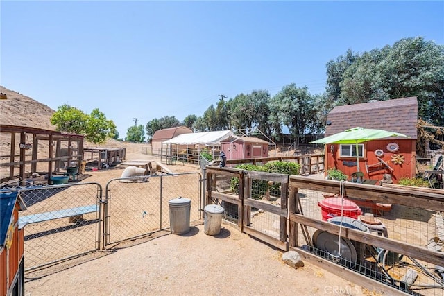 1390 Corona Ave, Norco, CA 92860 - view of patio with a gate and a shed