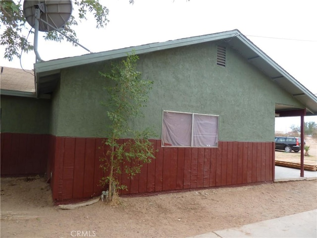313 Dr Martin Luther King Jr Blvd, Bakersfield, CA 93307 - view of side of home featuring stucco siding
