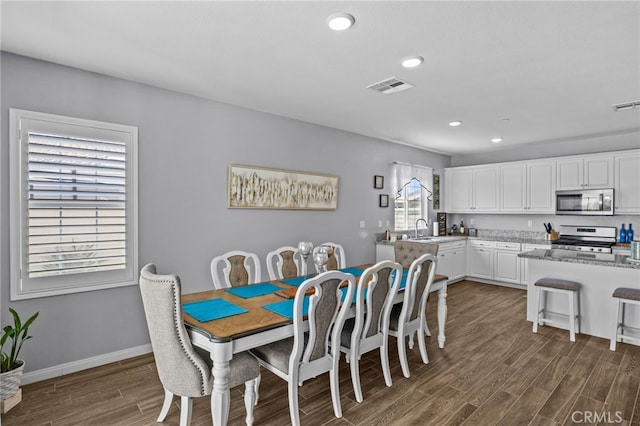 24909 Miners View Ln, Moreno Valley, CA 92557 - dining space featuring dark wood-style flooring and recessed lighting