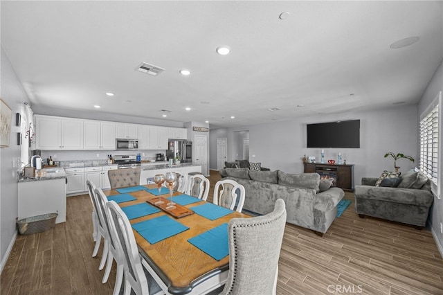 24909 Miners View Ln, Moreno Valley, CA 92557 - dining area featuring wood finished floors and recessed lighting