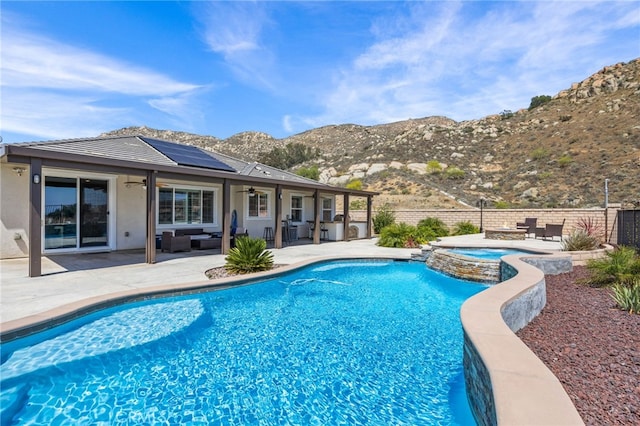 24909 Miners View Ln, Moreno Valley, CA 92557 - view of swimming pool with ceiling fan, an outdoor living space, a mountain view, a patio, and a pool with connected hot tub