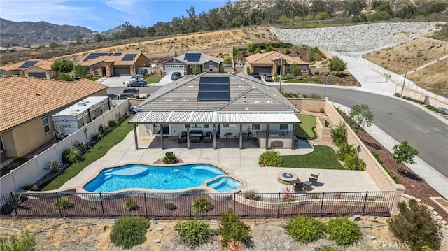 24909 Miners View Ln, Moreno Valley, CA 92557 - view of pool with a fenced backyard, a patio, a pool with connected hot tub, a residential view, and an outdoor hangout area