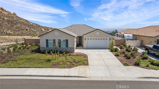 24909 Miners View Ln, Moreno Valley, CA 92557 - ranch-style house featuring an attached garage, driveway, stucco siding, and a gate