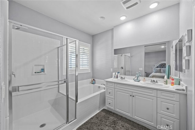 24909 Miners View Ln, Moreno Valley, CA 92557 - ensuite bathroom with double vanity, a bath, a stall shower, and recessed lighting