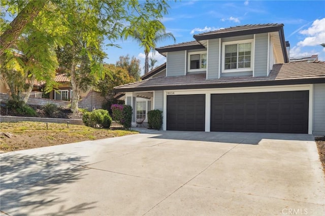 28034 Parkridge Ln, Canyon Country, CA 91387 - view of front of property featuring concrete driveway, a garage, and a tiled roof