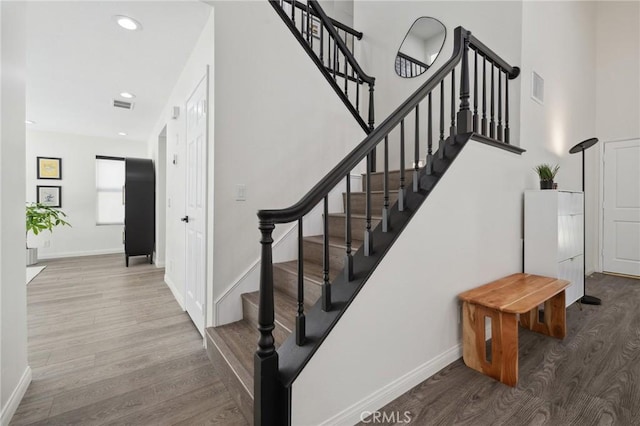 28034 Parkridge Ln, Canyon Country, CA 91387 - stairway with wood finished floors and recessed lighting