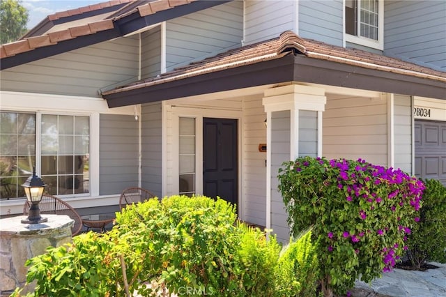 28034 Parkridge Ln, Canyon Country, CA 91387 - doorway to property featuring an attached garage
