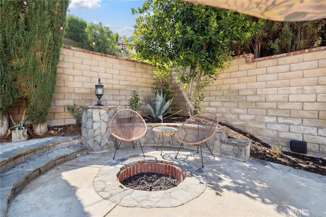 28034 Parkridge Ln, Canyon Country, CA 91387 - fenced backyard featuring a patio area and an outdoor fire pit