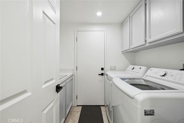28034 Parkridge Ln, Canyon Country, CA 91387 - washroom featuring washing machine and clothes dryer, cabinet space, light tile patterned floors, and recessed lighting