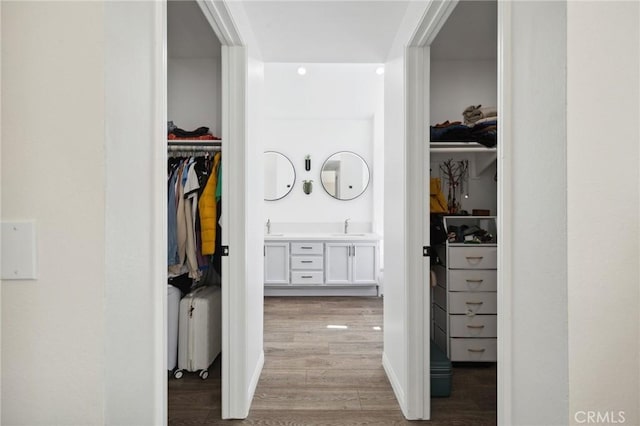 28034 Parkridge Ln, Canyon Country, CA 91387 - hallway featuring a sink and light wood-style flooring