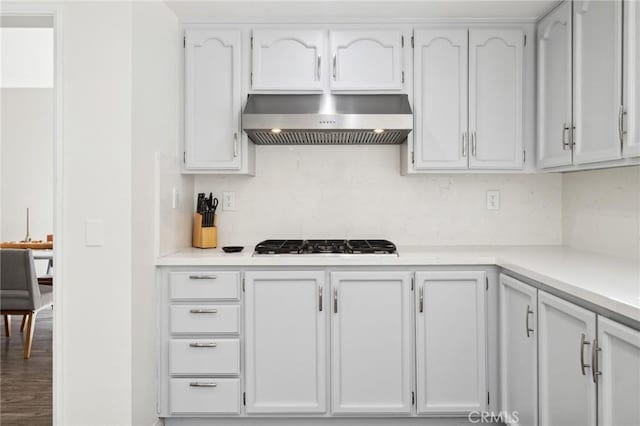 28034 Parkridge Ln, Canyon Country, CA 91387 - kitchen with ventilation hood, gas cooktop, backsplash, and light countertops