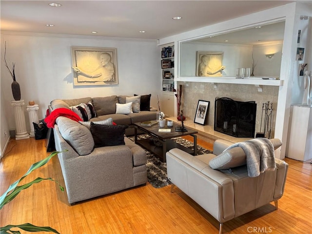 357 Cumberland Rd, Glendale, CA 91202 - living area featuring a premium fireplace, wood finished floors, crown molding, recessed lighting, and built in shelves