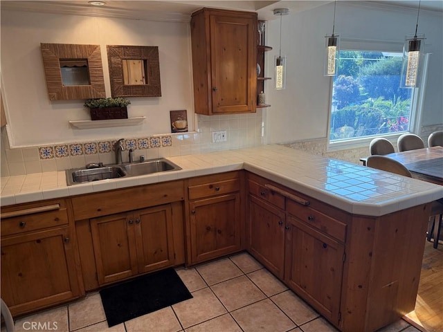 357 Cumberland Rd, Glendale, CA 91202 - kitchen with open shelves, a sink, a peninsula, decorative backsplash, and crown molding