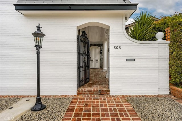508 Evening Star Ln, Newport Beach, CA 92660 - doorway to property with a standing seam roof, a gate, and metal roof