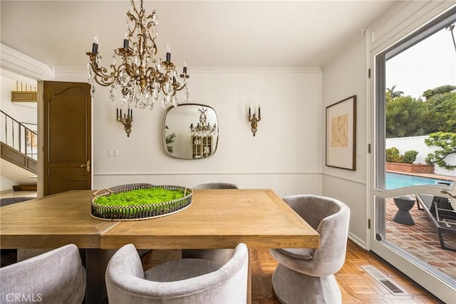 508 Evening Star Ln, Newport Beach, CA 92660 - dining area featuring a chandelier, crown molding, and stairway