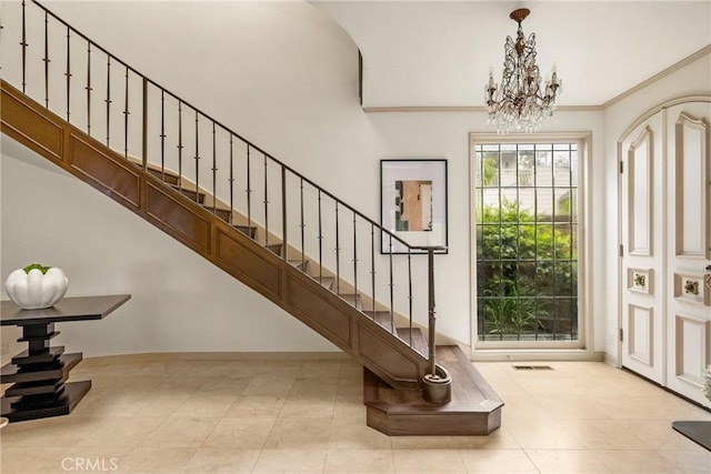 508 Evening Star Ln, Newport Beach, CA 92660 - foyer featuring a chandelier, stairway, baseboards, tile patterned flooring, and crown molding