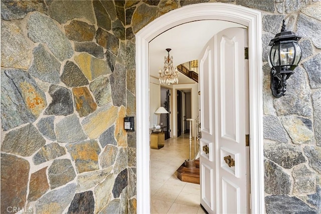 508 Evening Star Ln, Newport Beach, CA 92660 - corridor with tile patterned floors, arched walkways, and a chandelier