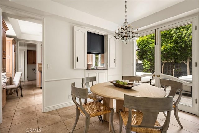 508 Evening Star Ln, Newport Beach, CA 92660 - dining space featuring plenty of natural light, a chandelier, light tile patterned floors, and a tray ceiling