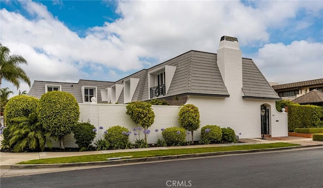 508 Evening Star Ln, Newport Beach, CA 92660 - view of side of property with mansard roof and a chimney