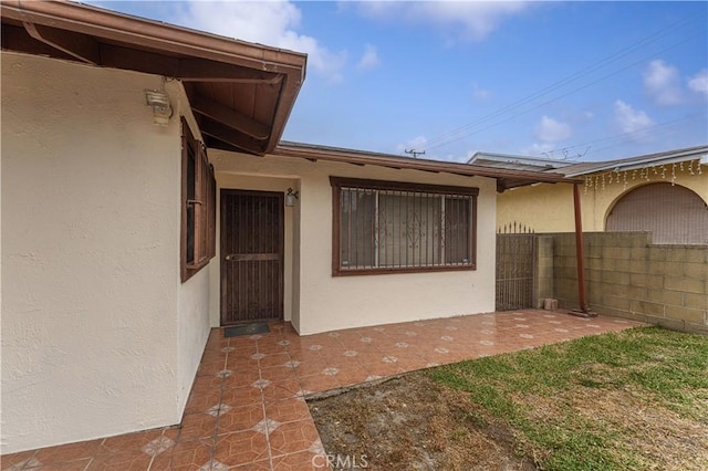 4820 Eagle St, Los Angeles, CA 90022 - property entrance with stucco siding and a patio area