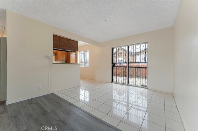 4820 Eagle St, Los Angeles, CA 90022 - tiled spare room with a textured ceiling