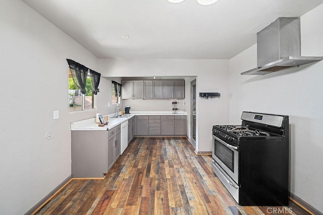 5150 N Berkeley Ave, San Bernardino, CA 92407 - kitchen with gray cabinets, stainless steel range with gas stovetop, wall chimney range hood, and dark wood-style flooring
