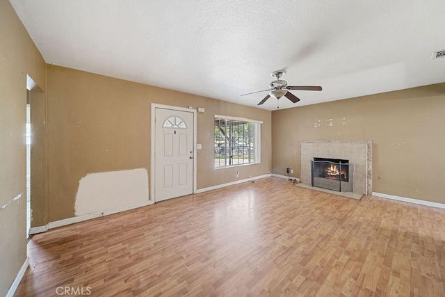 5150 N Berkeley Ave, San Bernardino, CA 92407 - unfurnished living room featuring light wood-type flooring, ceiling fan, and a premium fireplace