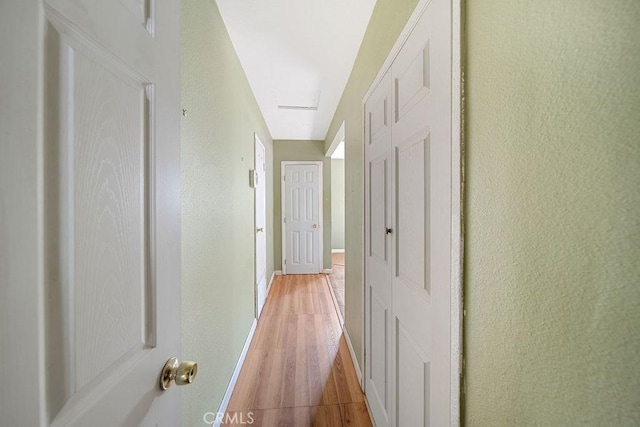 5150 N Berkeley Ave, San Bernardino, CA 92407 - hall featuring light wood-style flooring and baseboards