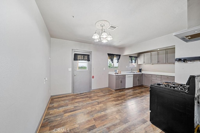 5150 N Berkeley Ave, San Bernardino, CA 92407 - kitchen with gray cabinetry, black gas range, white dishwasher, a chandelier, and wood finished floors