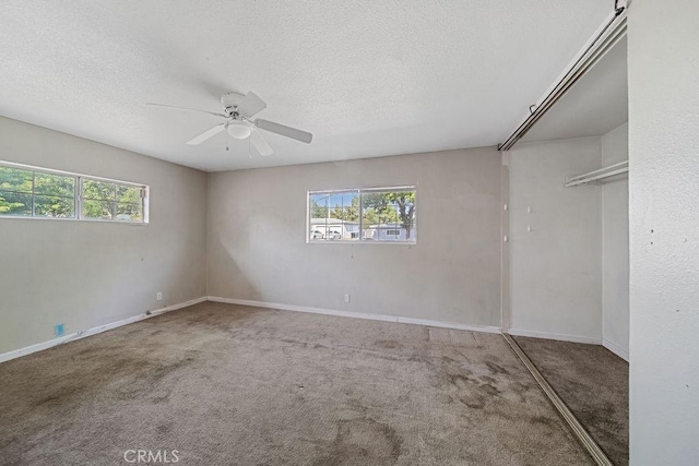 5150 N Berkeley Ave, San Bernardino, CA 92407 - empty room with carpet floors, healthy amount of natural light, ceiling fan, and a textured ceiling