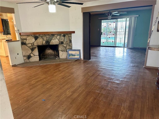 1947 Palm Ave, Monterey Park, CA 91755 - unfurnished living room with ceiling fan, wood finished floors, and a stone fireplace