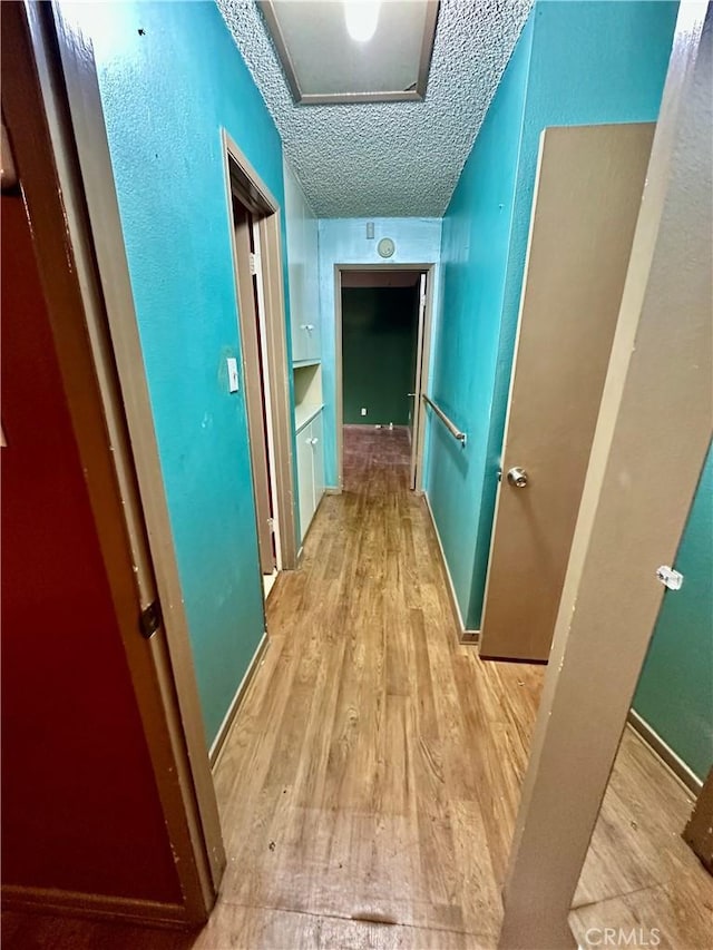 1947 Palm Ave, Monterey Park, CA 91755 - corridor featuring wood finished floors and a textured ceiling
