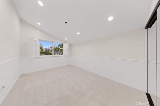 25811 Jamon Ln, Mission Viejo, CA 92691 - spare room featuring lofted ceiling, a wainscoted wall, recessed lighting, and carpet flooring
