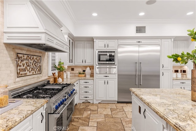 25811 Jamon Ln, Mission Viejo, CA 92691 - kitchen with built in appliances, premium range hood, a warming drawer, decorative backsplash, and crown molding