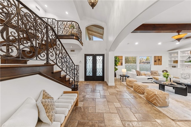 25811 Jamon Ln, Mission Viejo, CA 92691 - foyer with arched walkways, stone tile floors, stairway, french doors, and recessed lighting
